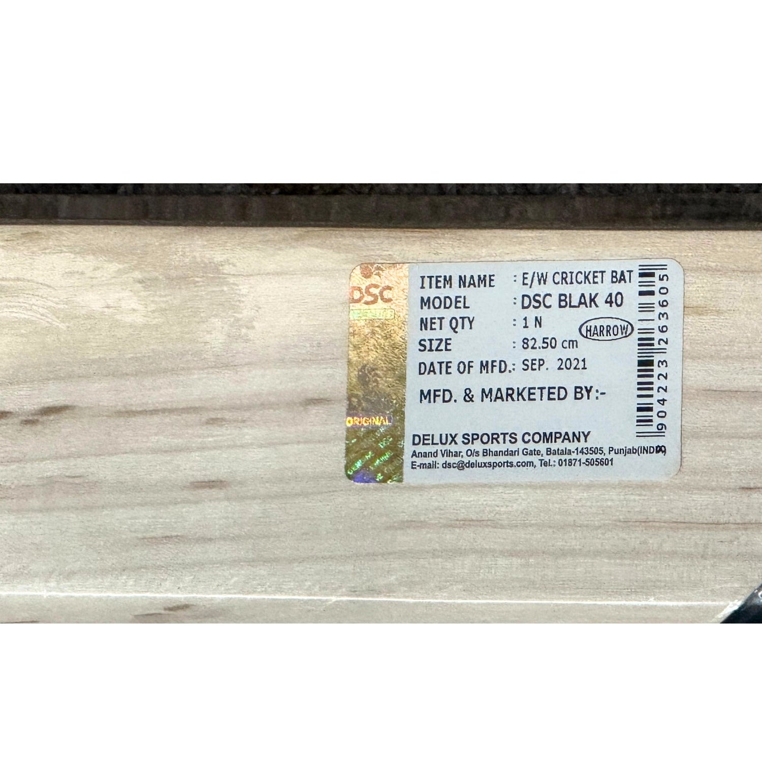 Wooden cricket bat with a visible brand label on a white background