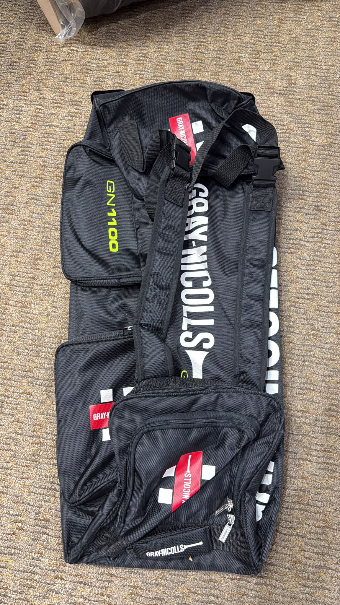 Black bag with visible branding on a textured surface