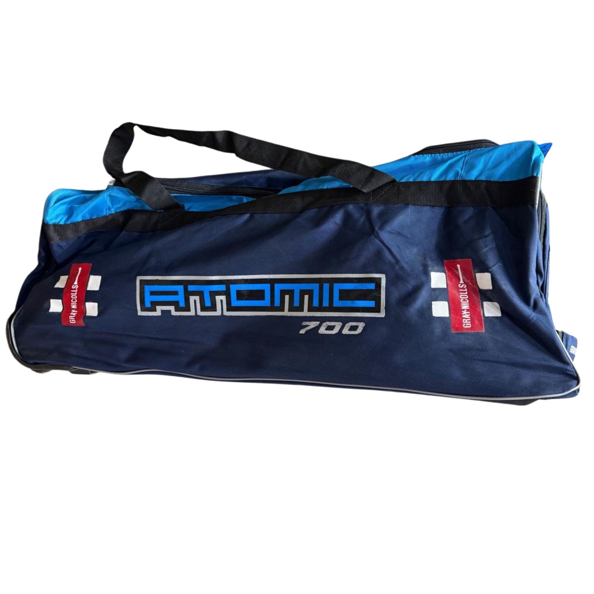 Blue sports bag with 'Atomic' branding on a white background